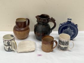 A Doulton Lambeth stoneware jug, an Egyptian limestone carved relief and other ceramics.
