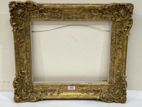 A gilt oil picture frame 20" x 23" overall, aperture 13" x 16".