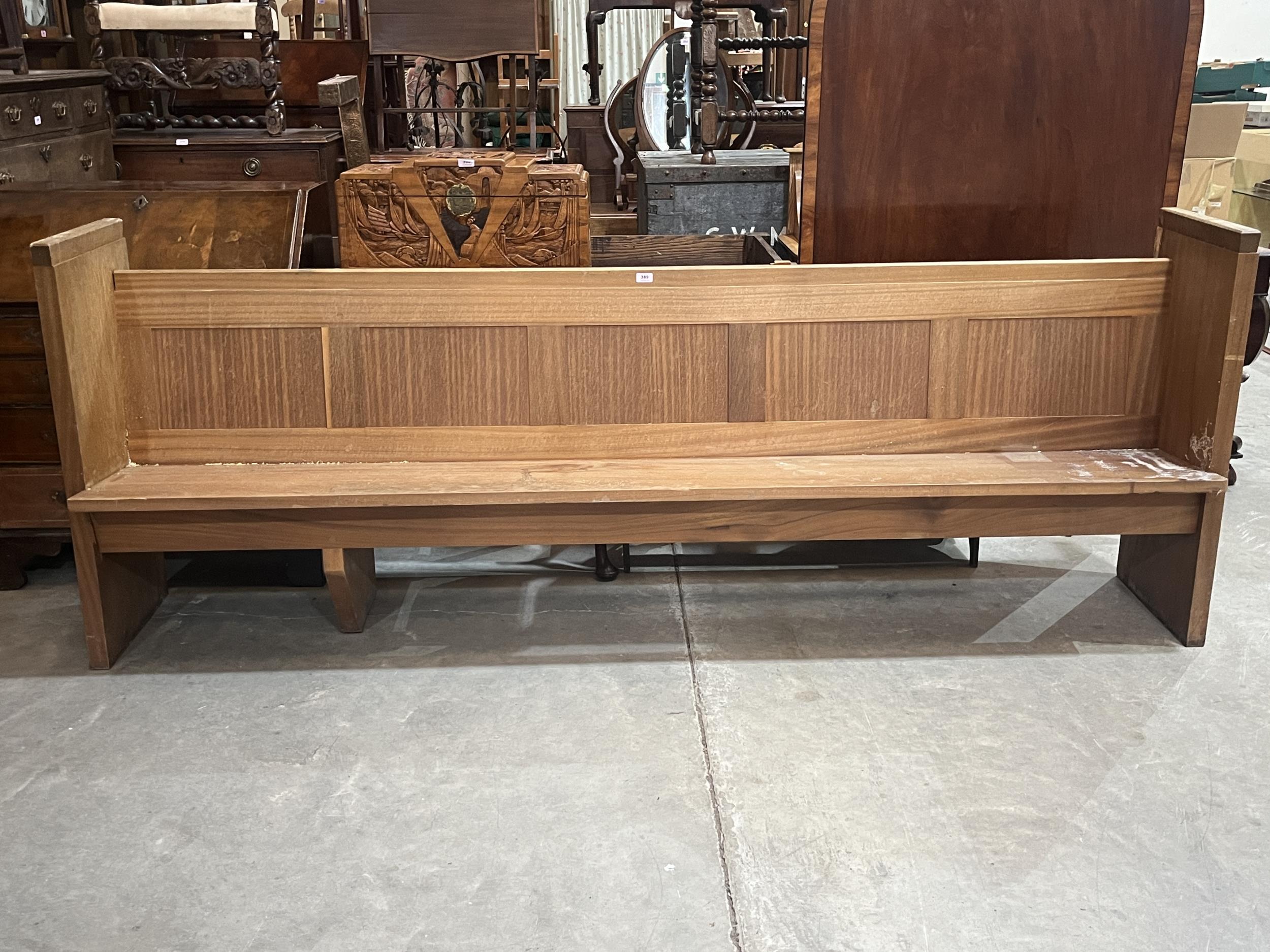 A 20th Century church pew. 101" long.