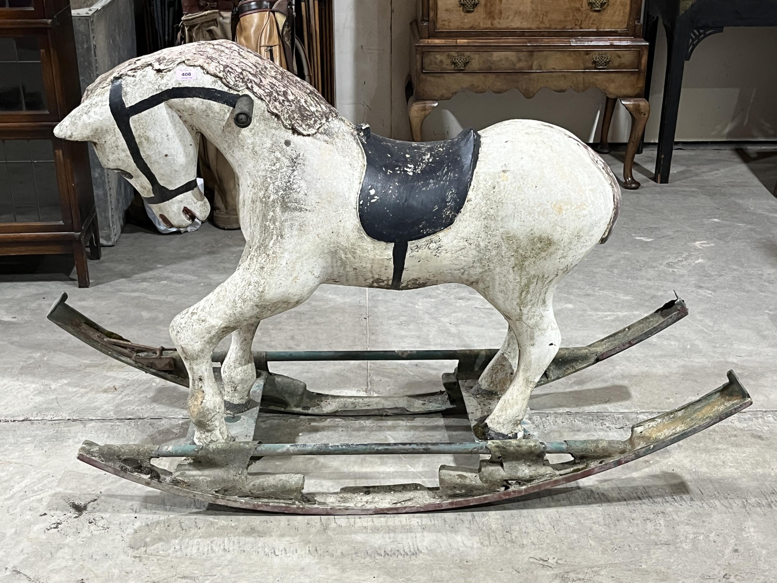 A fibreglass rocking horse. 40" high. (AF)