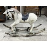 A fibreglass rocking horse. 40" high. (AF)