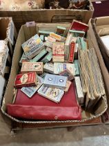 Matchbox labels, cigarette cards and empty cigarette packets.