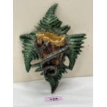 A majolica bird's nest, serpent and fern wall pocket. Probably Palissy c.1890. 8" high. Repair to