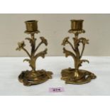 A pair of 19th Century French revived rococo bronze ormolu candlesticks. 6½" high.