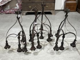 A set of four early 20th Century wrought metal hanging lamps. 31" high.