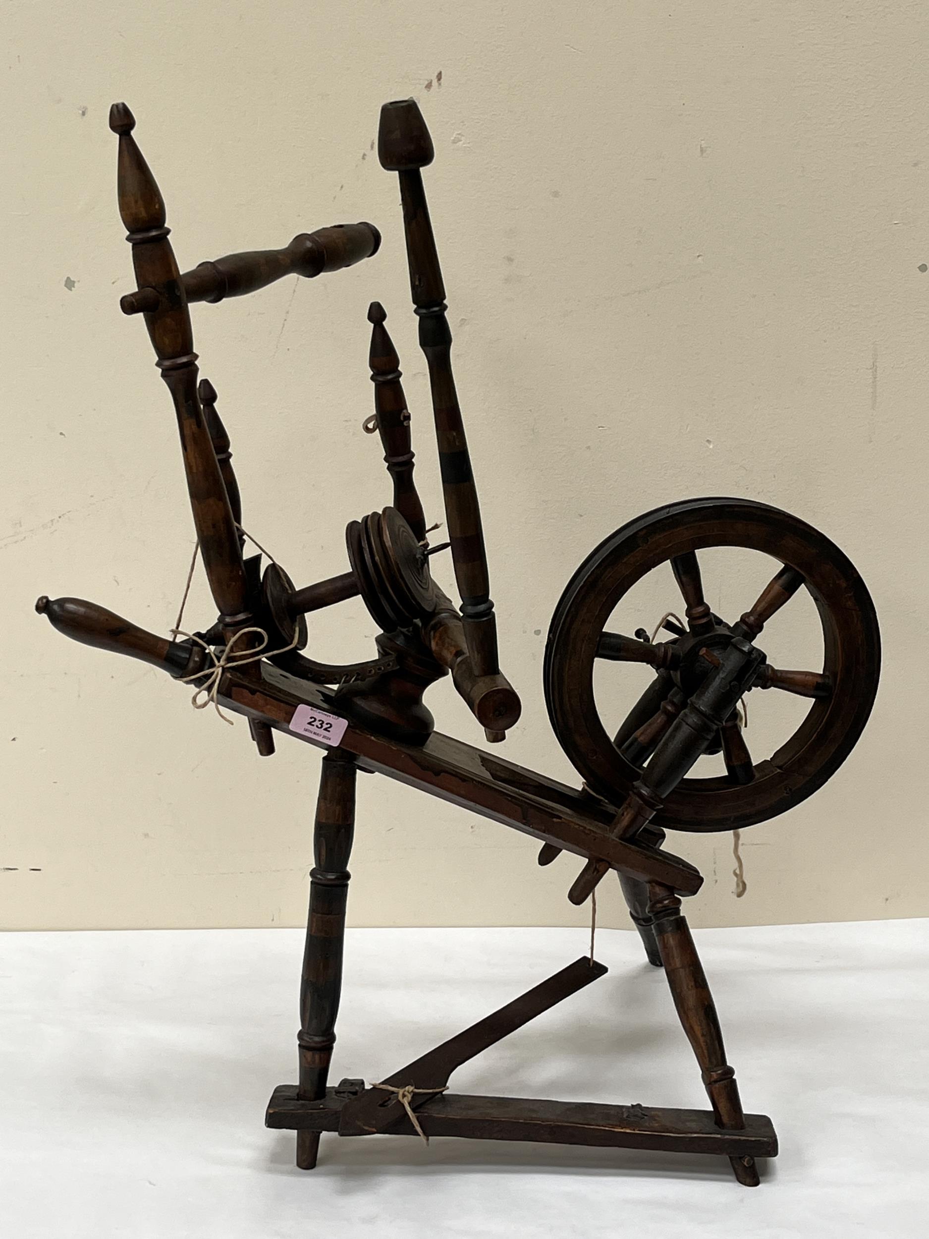 A Victorian flax spinning wheel, 30" high.