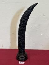 A resinous decorated horn form ornament, 15" high.