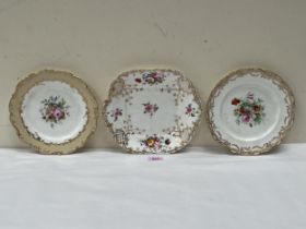 Three 19th Century Coalport plates, gilded and painted with summer flowers.