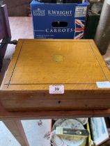 An oak cutlery box with mother-of-pearl hafted cutlery.