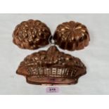 Three copper jelly moulds, the basket example 9" wide.