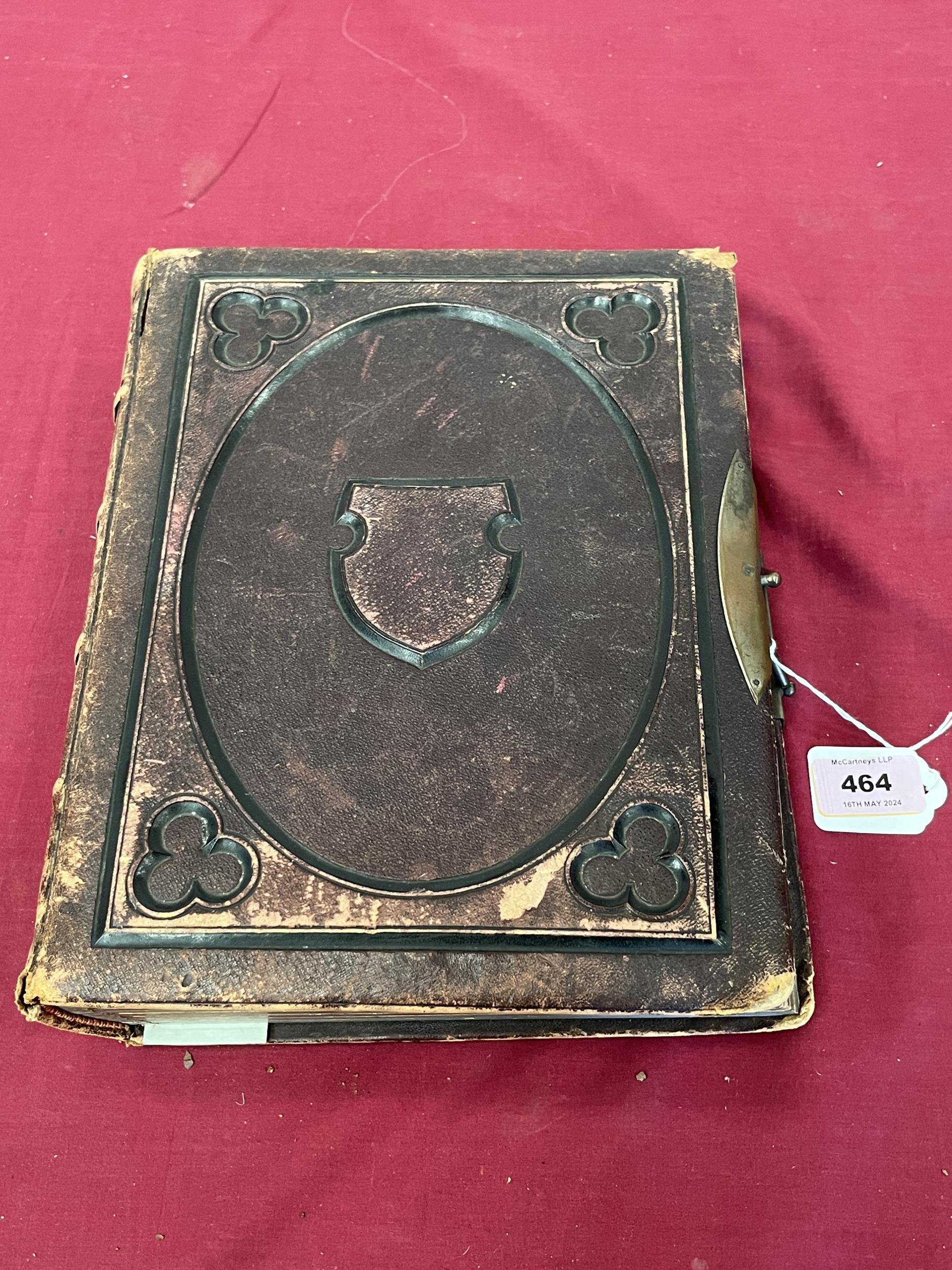 A Victorian leather bound photograph album, 11½" high.