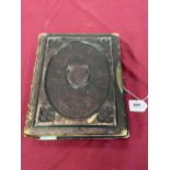 A Victorian leather bound photograph album, 11½" high.