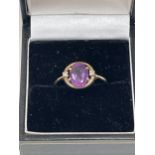A 9ct Art-Deco design amethyst and diamond ring. 2g gross. Size Q.