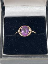 A 9ct Art-Deco design amethyst and diamond ring. 2g gross. Size Q.