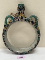 A 19th Century decorated ring flask. Possibly Italian. 9½" high.