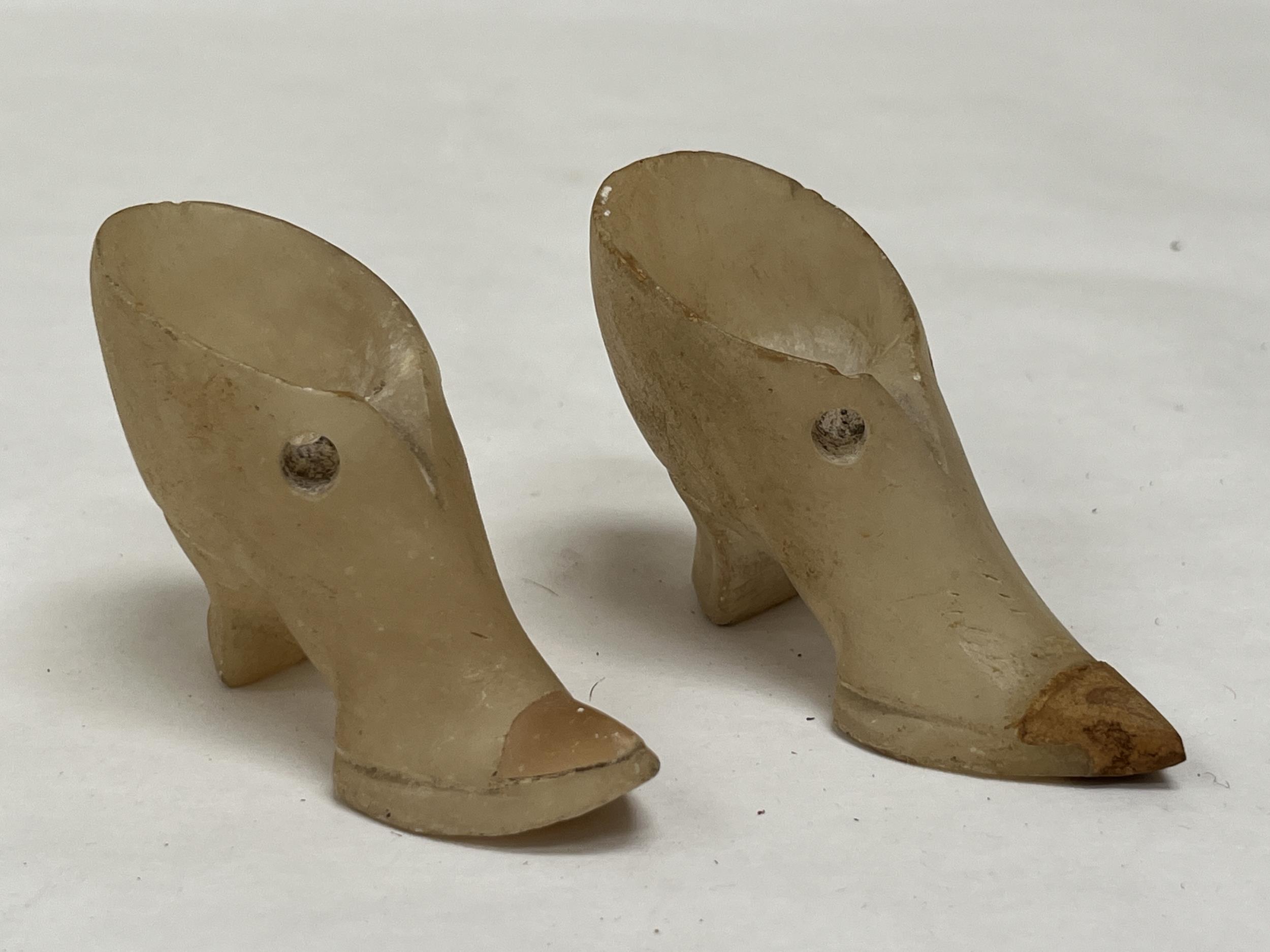 A pair of alabaster shoes, 3" long.