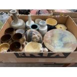 A box of studio pottery.