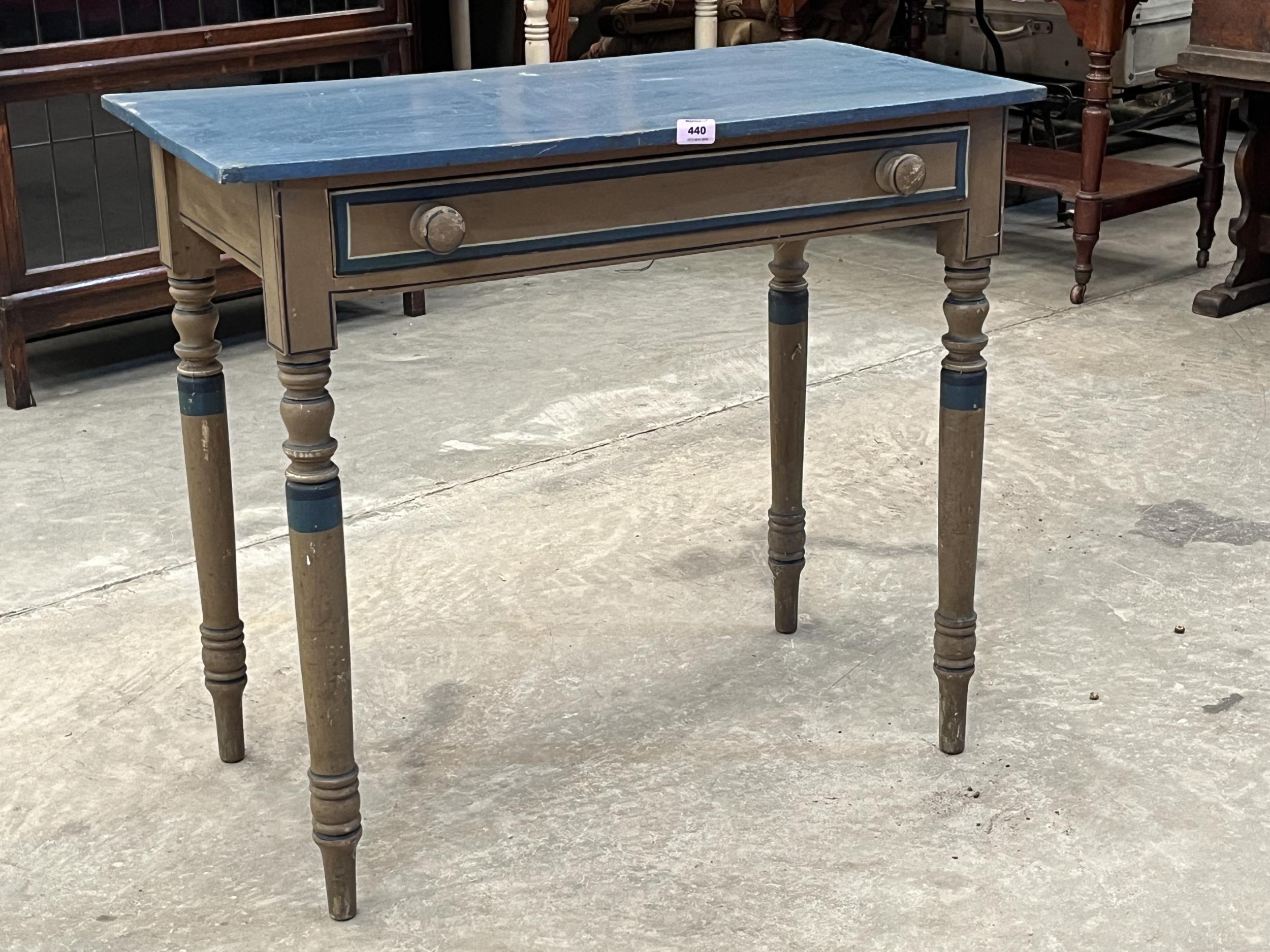 A George IV decorated pine side table with frieze drawer. 32" wide.