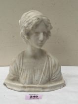 A carved stone female bust. 7½" high.