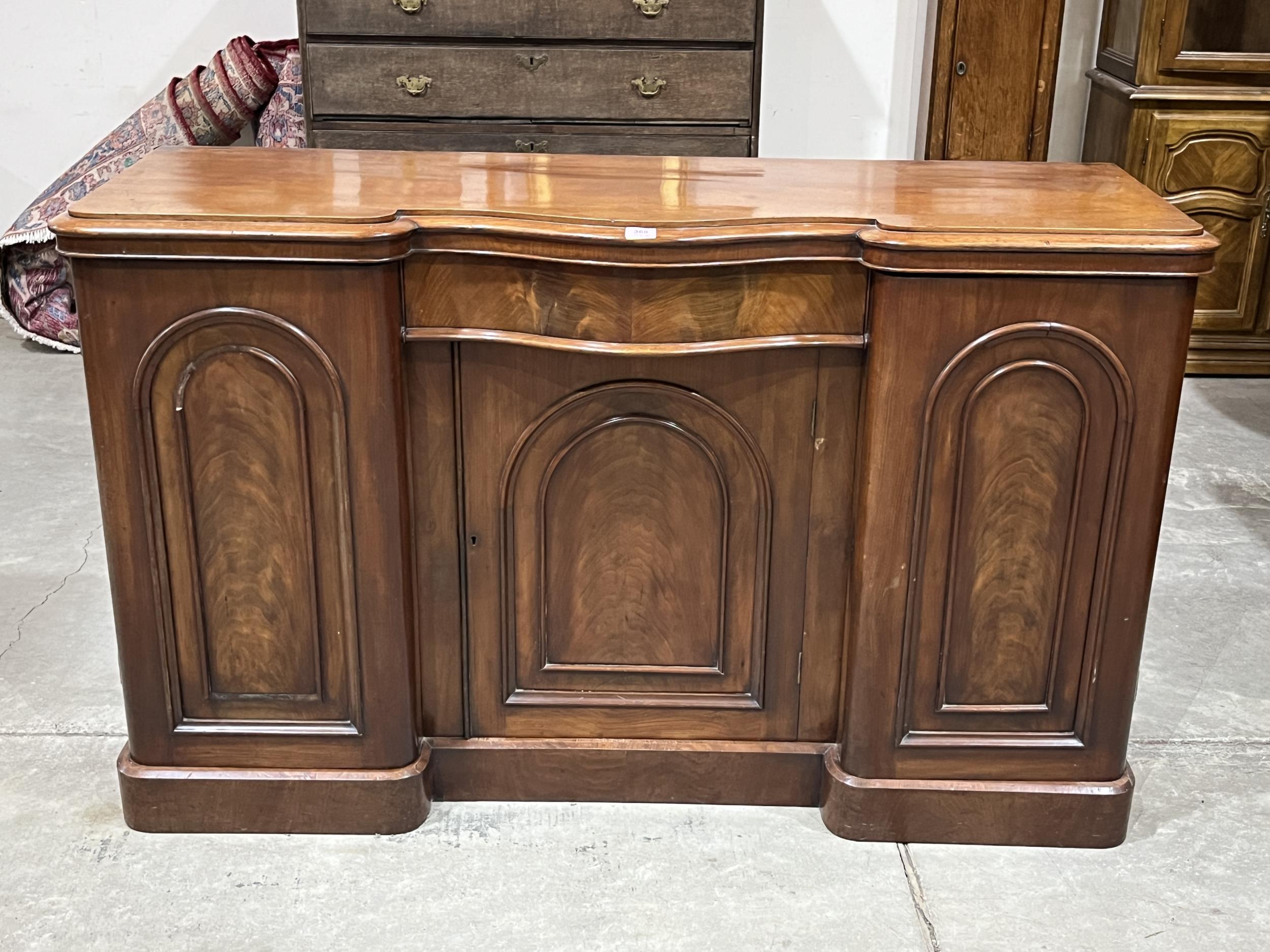 A Victorian mahogany inverted break-fronted sideboard. 60" wide.