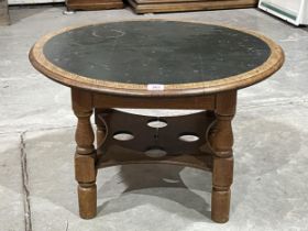 An oak low table with inlet top. 30" diam.