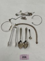 A small quantity of silver jewellery; two silver teaspoons; a silver sugar bow; and a silver salt