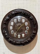 A late 19th Century Black Forest type oak wall clock with two train spring barrel movement