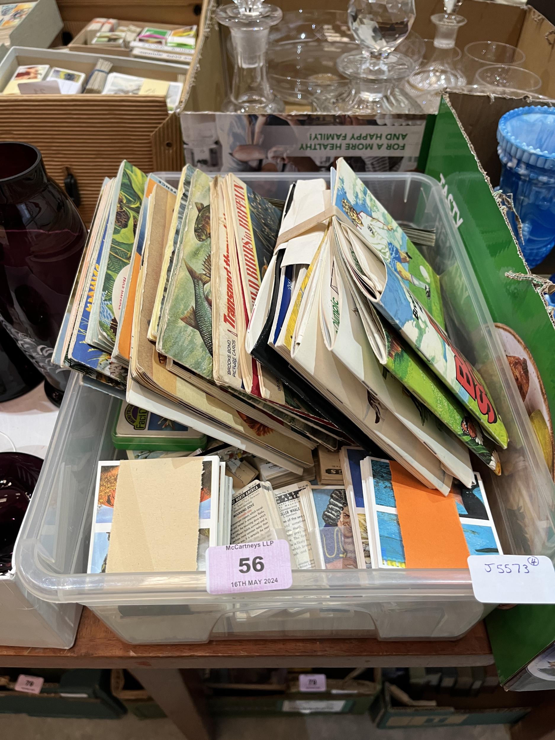 A box of trade cards in sets and albums.