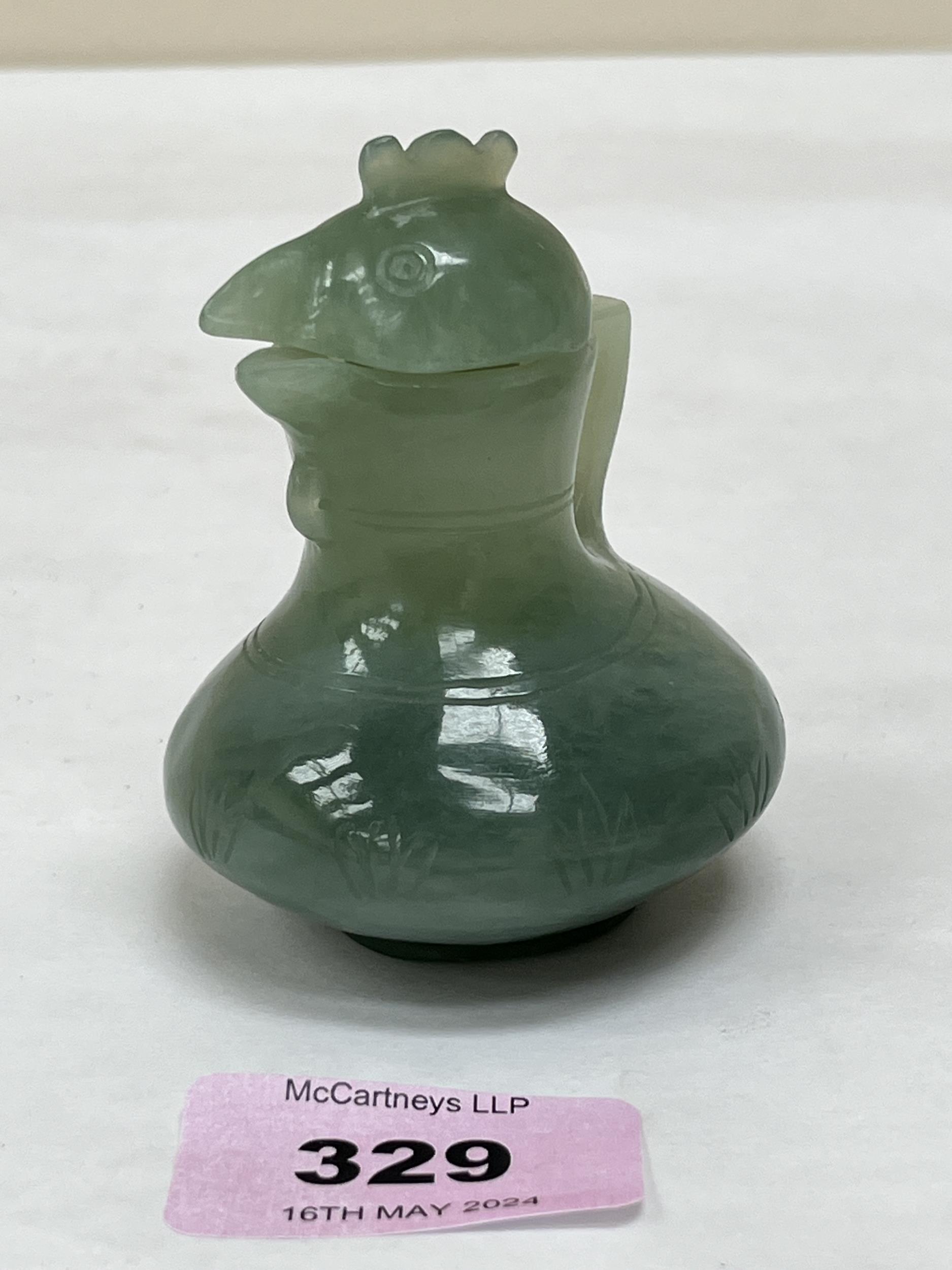 A Chinese green jade jug and cover, carved in the form of a cockerel. 3" high. - Image 2 of 2