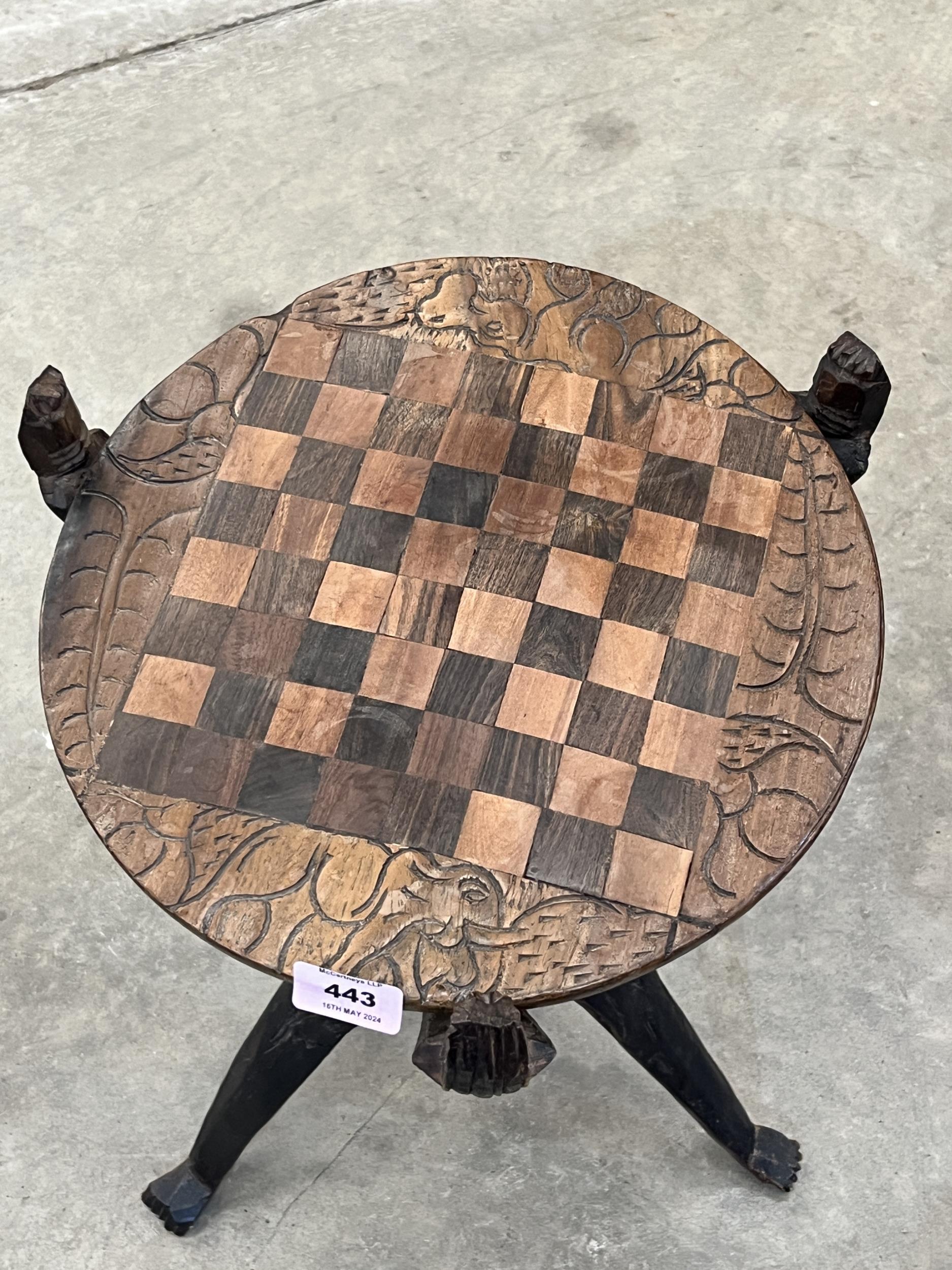A 19th Century Indian hardwood table, the top carved and inlaid with a chessboard and carved to - Image 2 of 3