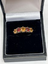 A 9ct five stone citrine ring, 2.6g gross. Size L.