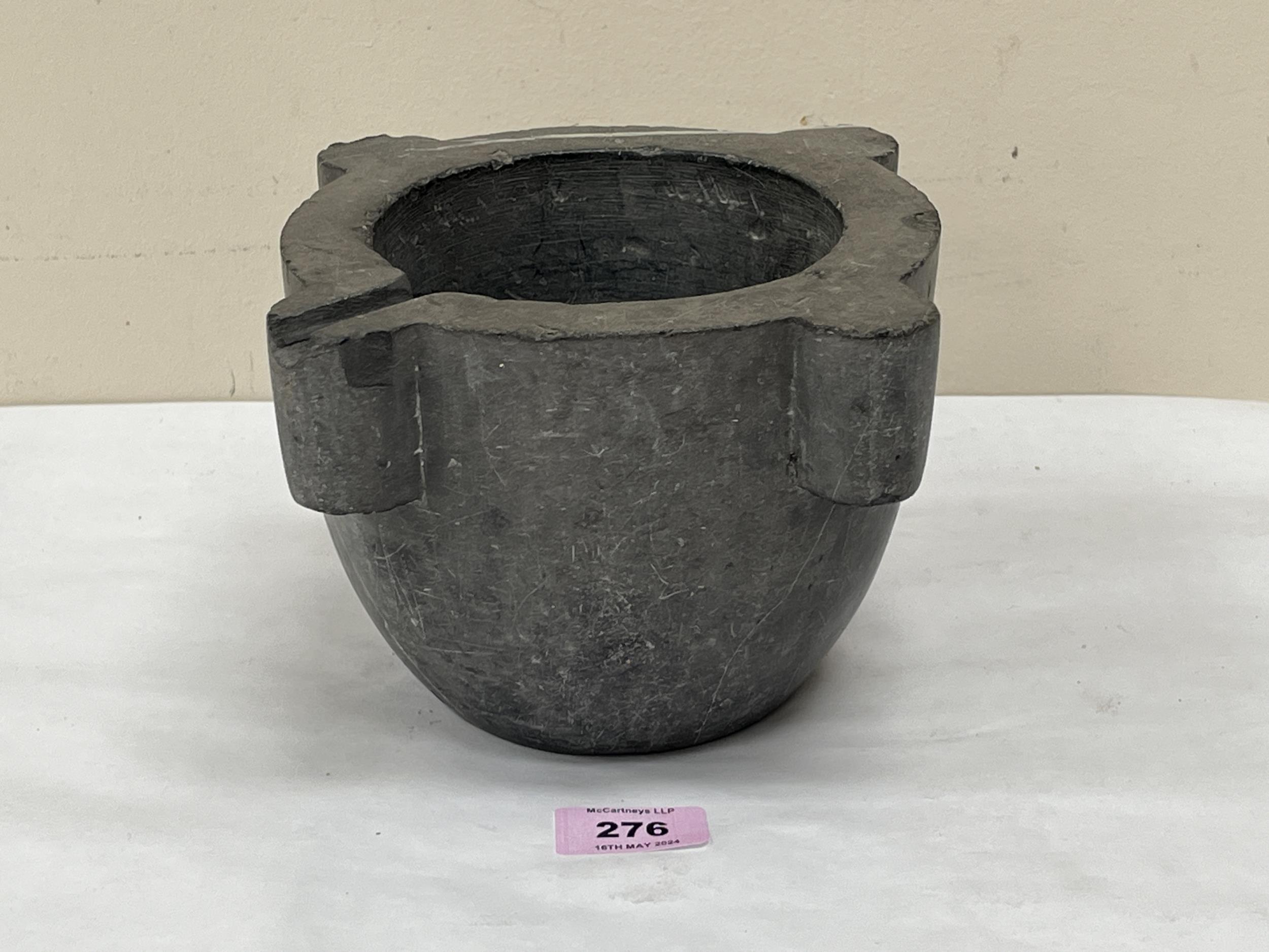 A marble mortar of lobed form. 5" high.