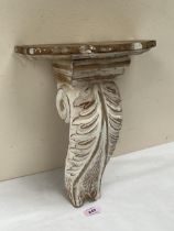 A decorated pine wall bracket of scrolled acanthus carved corbel form. 14" high.