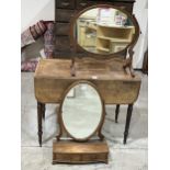 A 19th Century mahogany Pembroke table with drawer and blind drawer, on ring turned tapered legs.