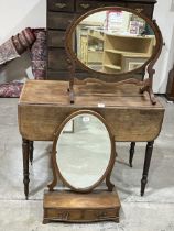 A 19th Century mahogany Pembroke table with drawer and blind drawer, on ring turned tapered legs.