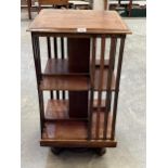 An Edward VII mahogany and crossbanded rotating bookcase. 33" high.