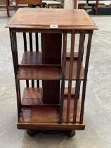 An Edward VII mahogany and crossbanded rotating bookcase. 33" high.