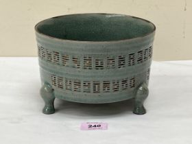 A Chinese crackle glazed three footed bowl with two bands of impressed decoration to the sides and