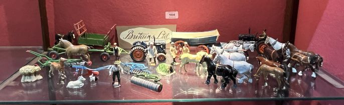 Britains Toys. A collection of farm implements, vehicles, figures and animals.