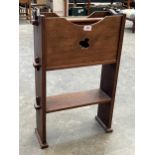 An Arts and Crafts mahogany magazine and book rack. 27" high.