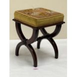 A Victorian mahogany stool with tapestry seat. 11" wide.