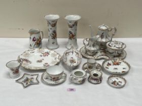 A collection of Dresden ceramics, all decorated with sprays of summer flowers.