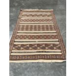 An Algerian flat weave carpet, 8'2" x 4'9".