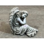 A statuary garden angel. 15" high.