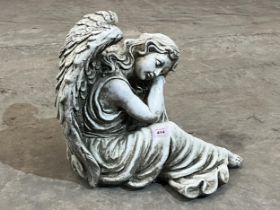 A statuary garden angel. 15" high.