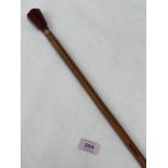 A 19th Century bamboo walking cane with hardstone pommel. 36" long.