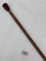 A 19th Century bamboo walking cane with hardstone pommel. 36" long.