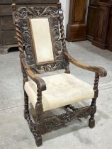 A 17th Century Flemish carved walnut armchair with barleytwist column uprights and stretchers.