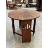 An oak Arts and Craft drop leaf table, 35½" wide.