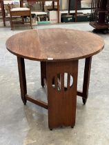 An oak Arts and Craft drop leaf table, 35½" wide.